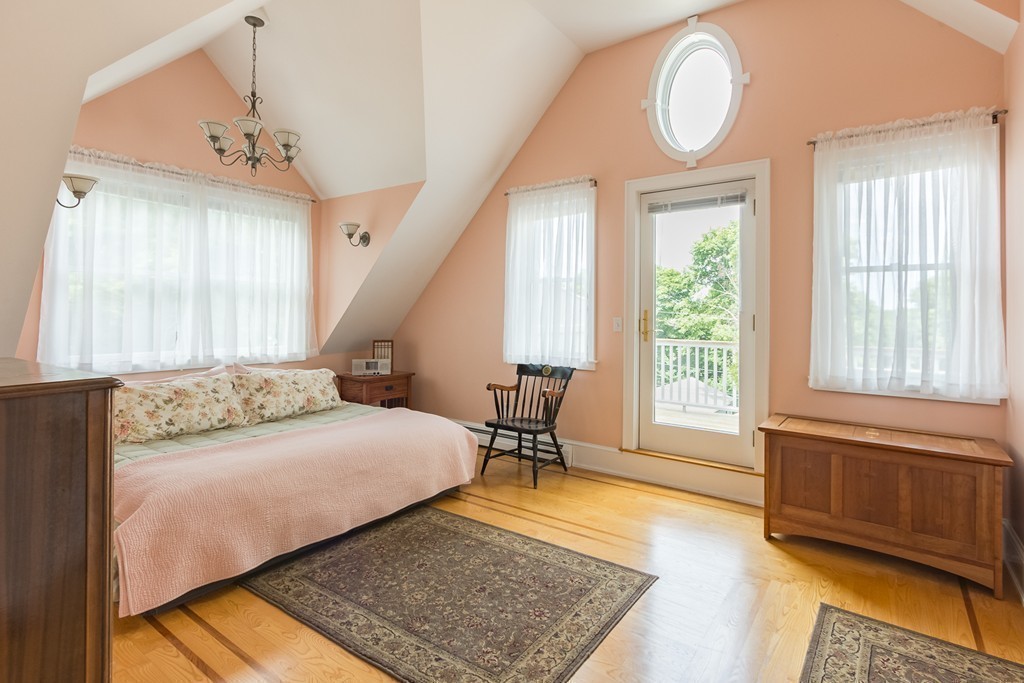 4 Echo Avenue Gloucester, MA 01930 - Photo 14 of 26 a bedroom with a bed and wooden floor