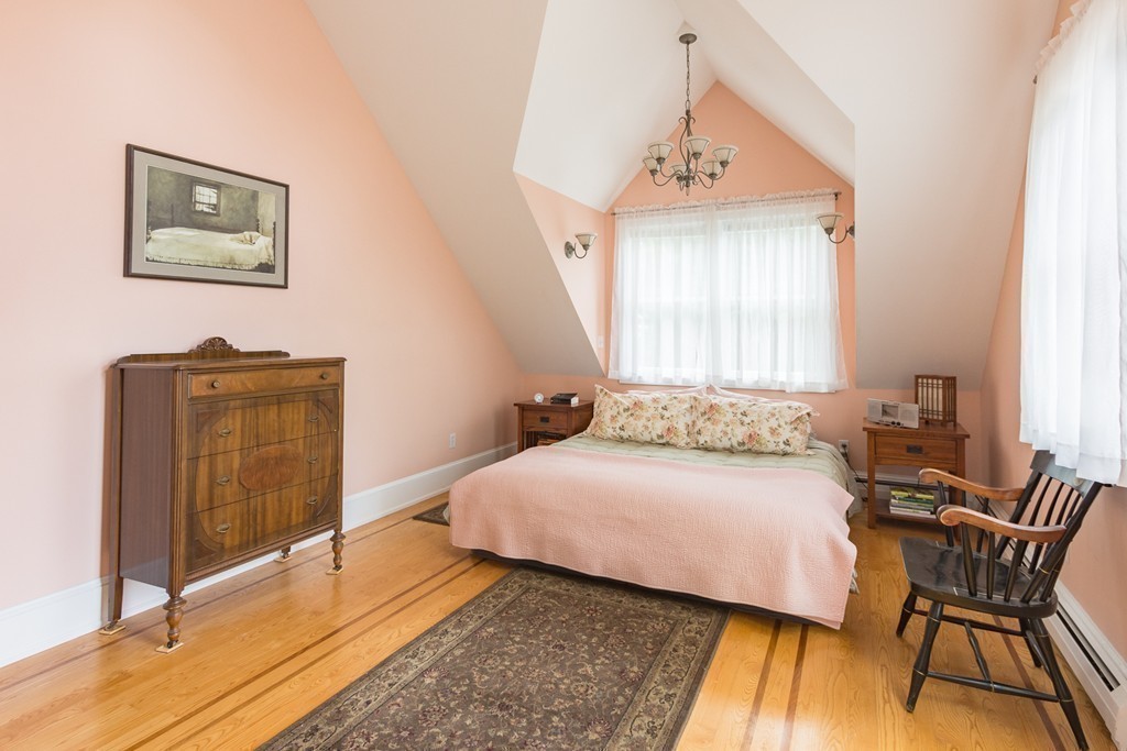 4 Echo Avenue Gloucester, MA 01930 - Photo 15 of 26 a bedroom with a bed and wooden floor