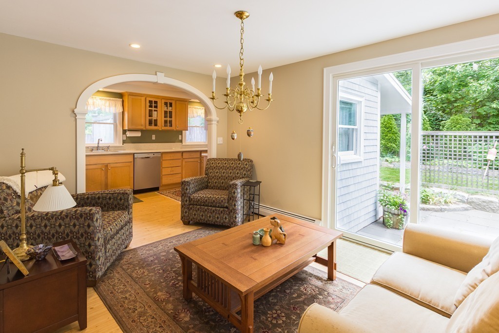 4 Echo Avenue Gloucester, MA 01930 - Photo 4 of 26 a living room with furniture and a chandelier