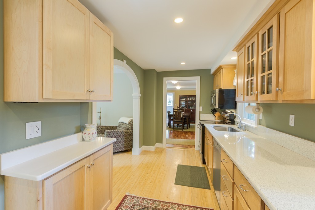 4 Echo Avenue Gloucester, MA 01930 - Photo 7 of 26 a kitchen with a sink a counter top space cabinets and appliances