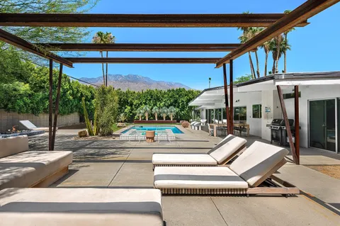 a view of a swimming pool with a patio