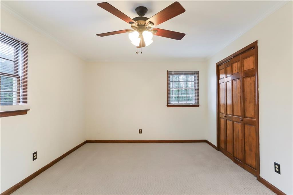 1132 Lafayette Drive Southwest Mableton, GA 30126 - Photo 15 of 35 an empty room with windows and fan