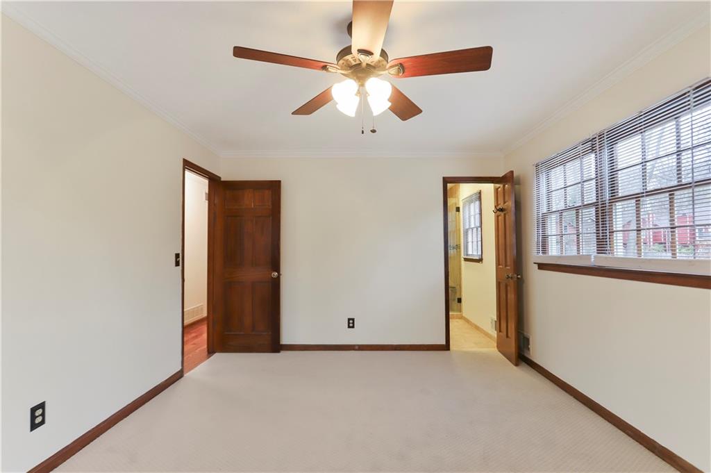 1132 Lafayette Drive Southwest Mableton, GA 30126 - Photo 16 of 35 an empty room with chandelier fan