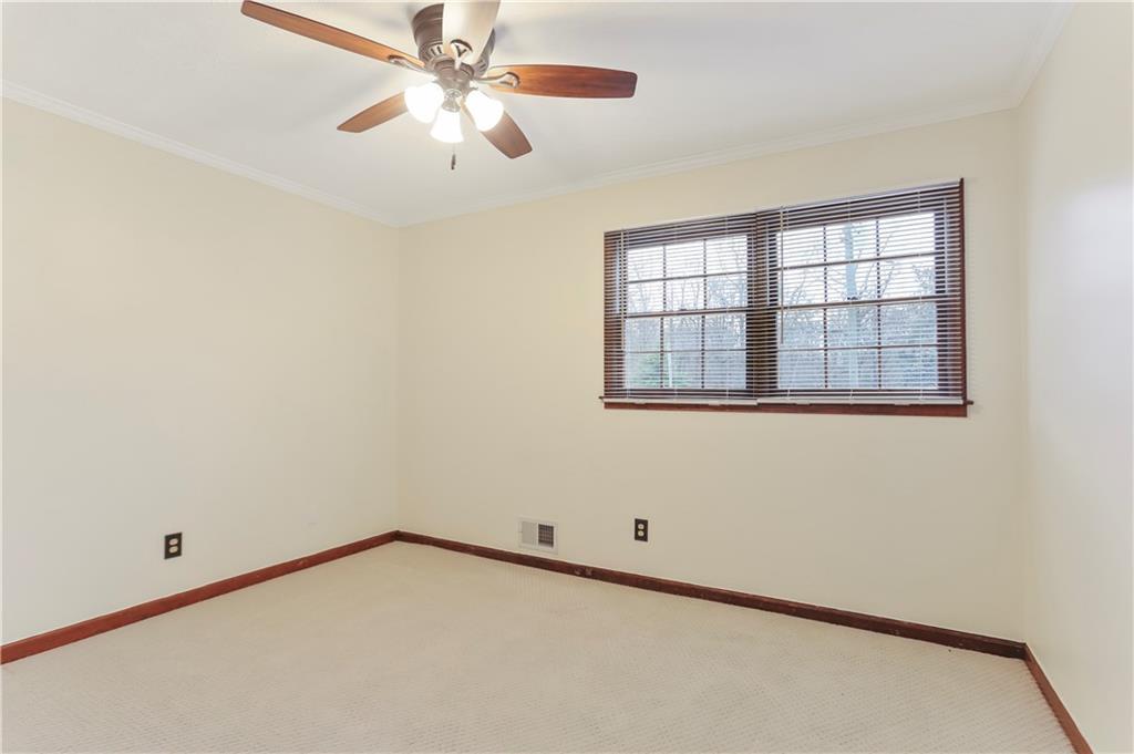 1132 Lafayette Drive Southwest Mableton, GA 30126 - Photo 18 of 35 an empty room with a window and a fan