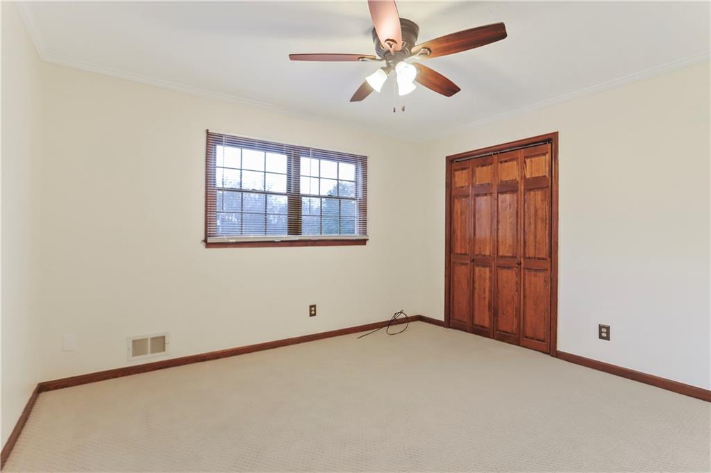 1132 Lafayette Drive Southwest Mableton, GA 30126 - Photo 21 of 35 an empty room with windows and fan