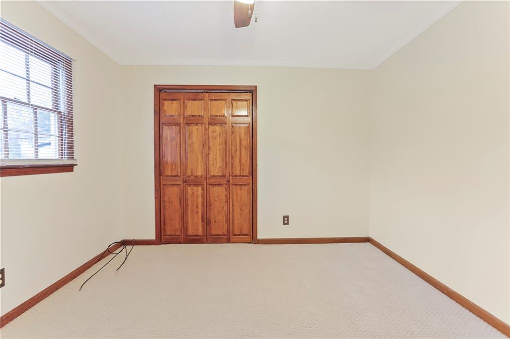 1132 Lafayette Drive Southwest Mableton, GA 30126 - Photo 22 of 35 an empty room with windows