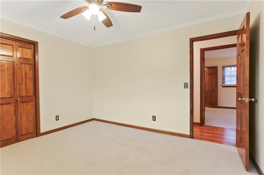 1132 Lafayette Drive Southwest Mableton, GA 30126 - Photo 23 of 35 an empty room with chandelier fan