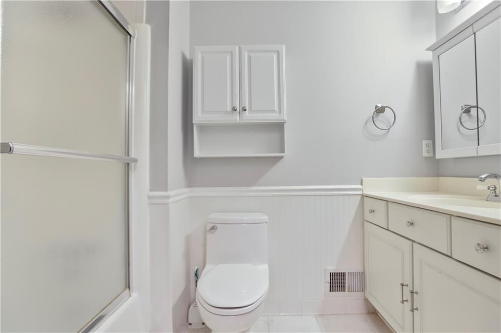 1132 Lafayette Drive Southwest Mableton, GA 30126 - Photo 24 of 35 a bathroom with a toilet sink vanity and granite