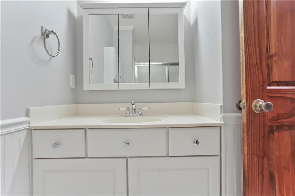1132 Lafayette Drive Southwest Mableton, GA 30126 - Photo 25 of 35 a bathroom with a sink and a mirror