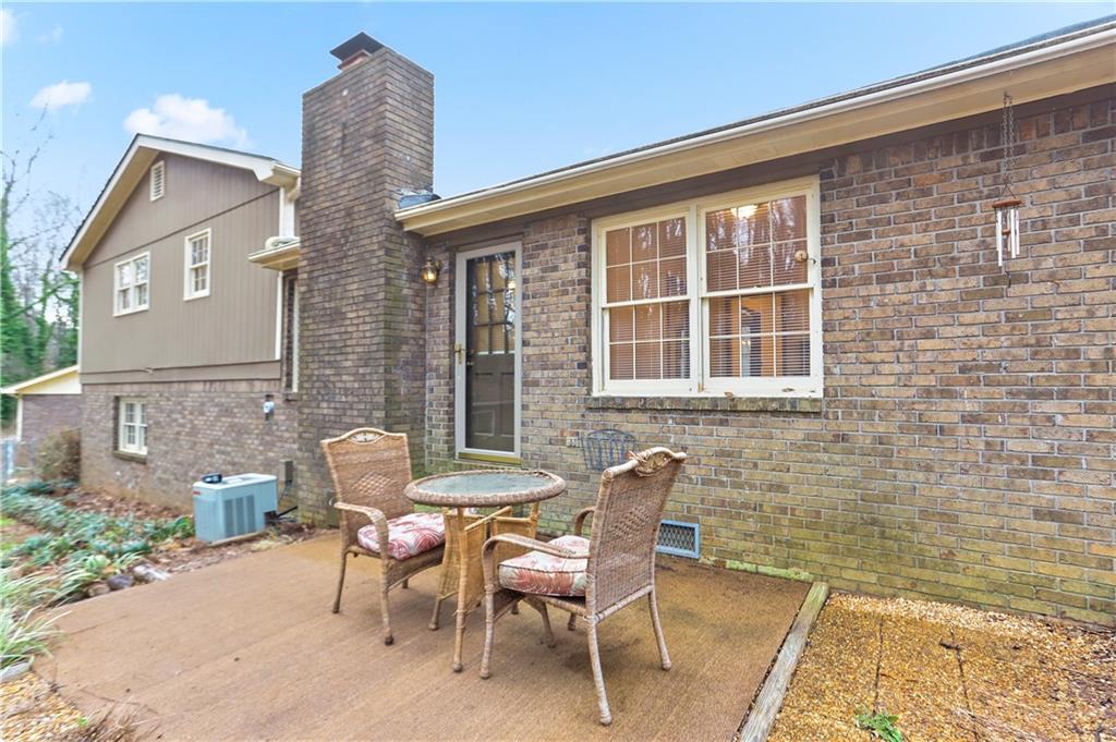 1132 Lafayette Drive Southwest Mableton, GA 30126 - Photo 29 of 35 a view of a patio with table and chairs and potted plants