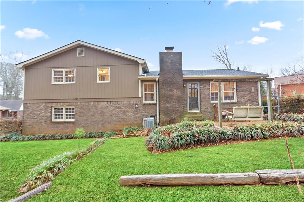 1132 Lafayette Drive Southwest Mableton, GA 30126 - Photo 31 of 35 a front view of a house with a yard