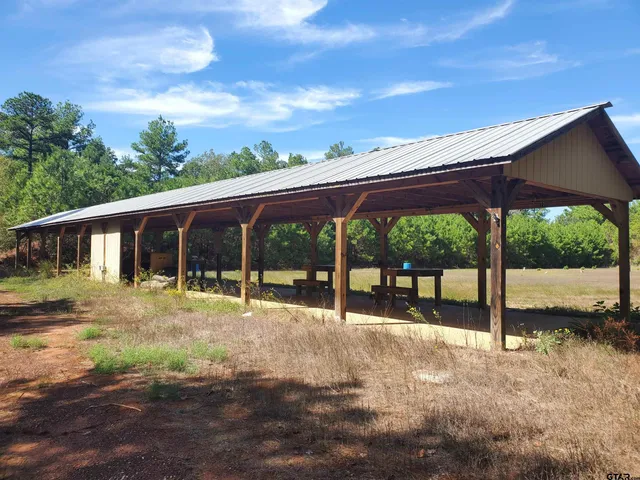 a backyard of a house with a garden and deck