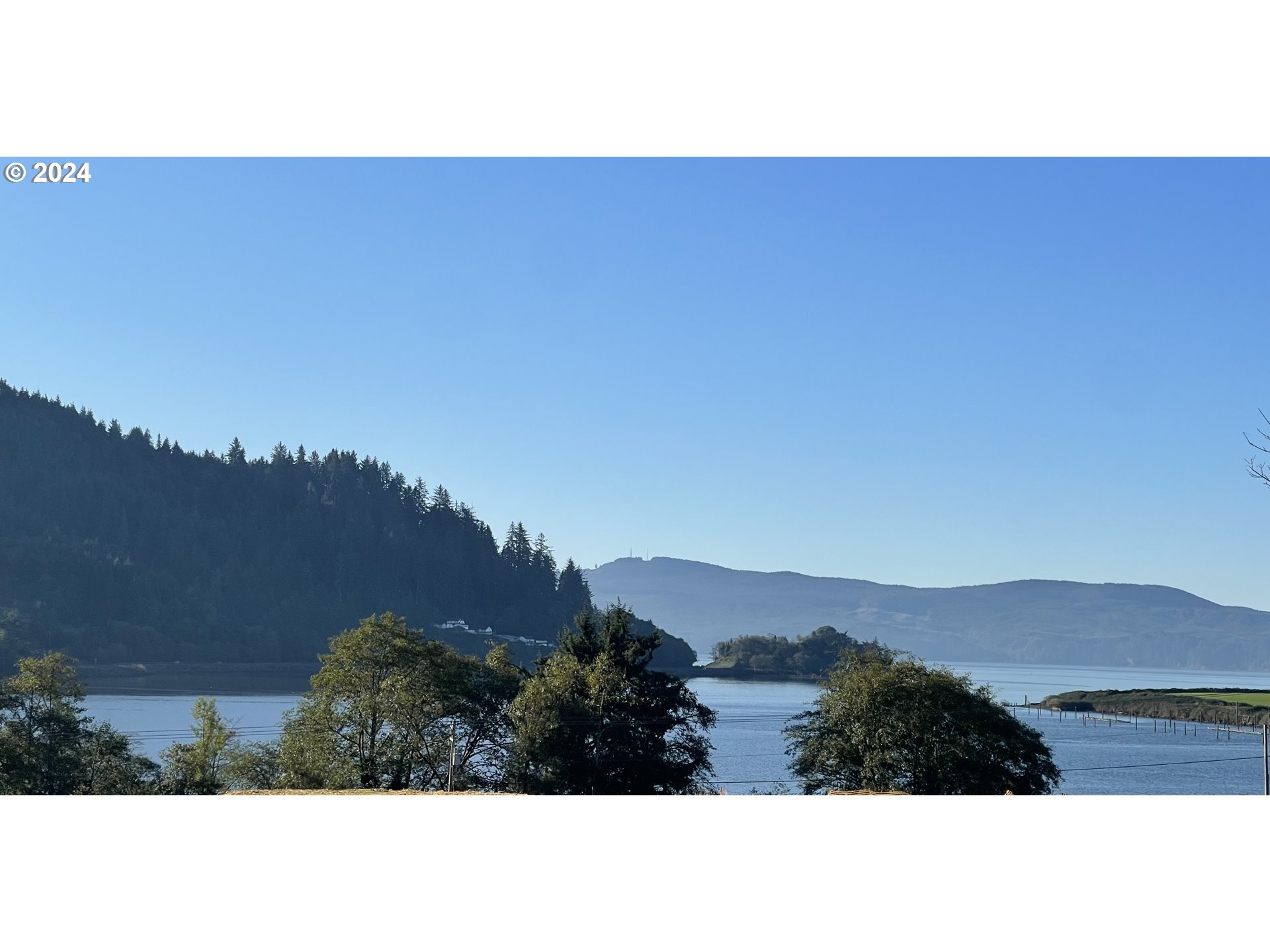 501 Garibaldi Avenue, Unit 6 Garibaldi, OR 97118 - Photo 1 of 24 a view of city and mountain