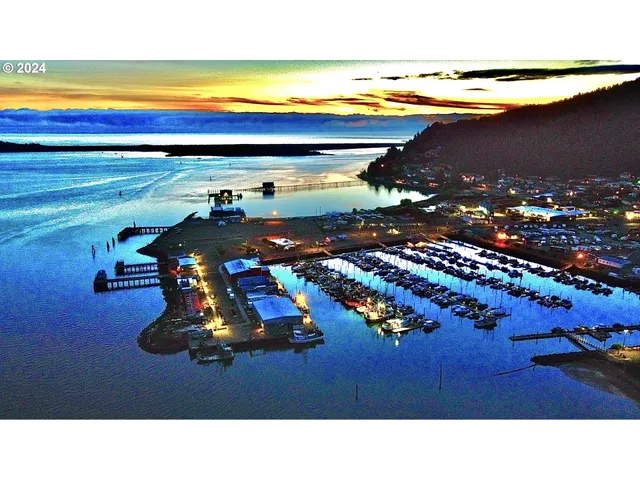 a view of a backyard with a table and chairs