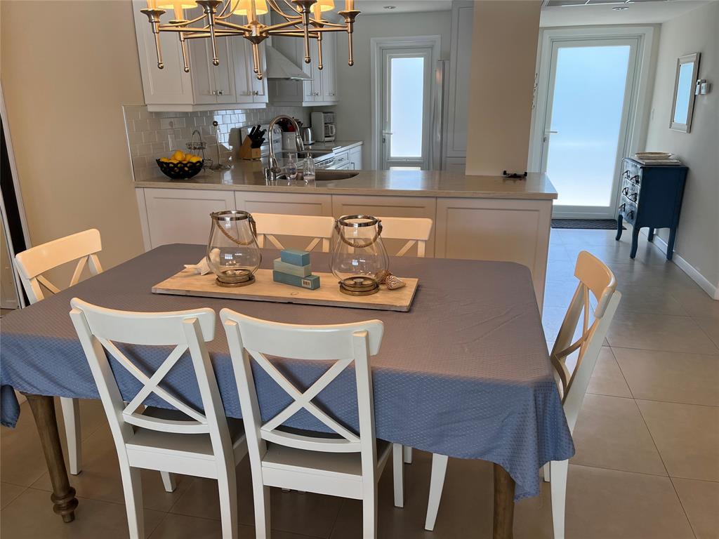 1481 South Ocean Boulevard, Unit 415A Pompano Beach, FL 33062 - Photo 11 of 39 a dining room with furniture and wooden floor