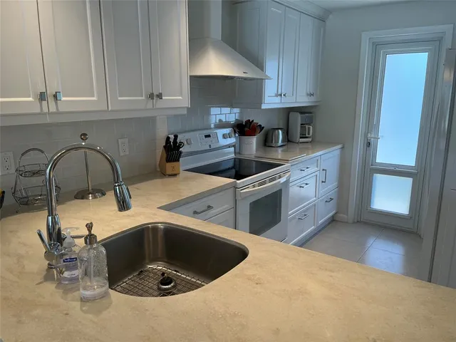 a kitchen with a sink and cabinets
