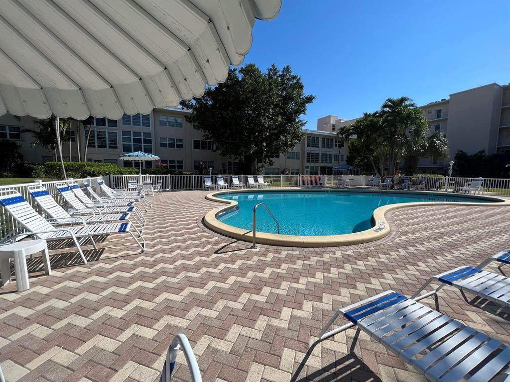1481 South Ocean Boulevard, Unit 415A Pompano Beach, FL 33062 - Photo 36 of 39 a view of a swimming pool with a patio