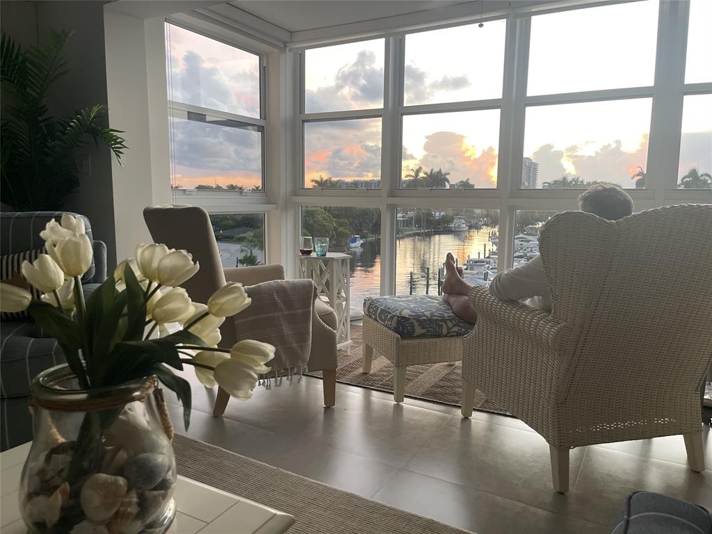 1481 South Ocean Boulevard, Unit 415A Pompano Beach, FL 33062 - Photo 5 of 39 a living room with furniture large window and wooden floor