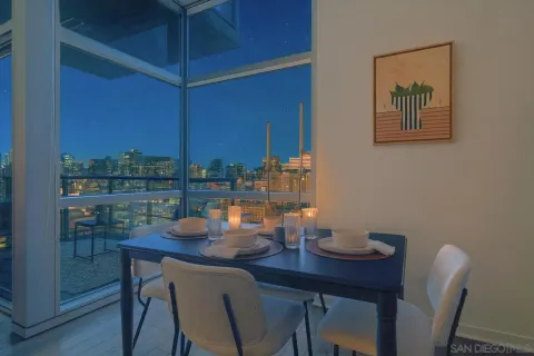 a spacious bedroom with a bed and glass door