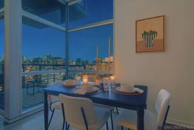 a dining room with furniture and window