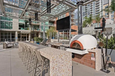 a view of a patio with dining table and chairs