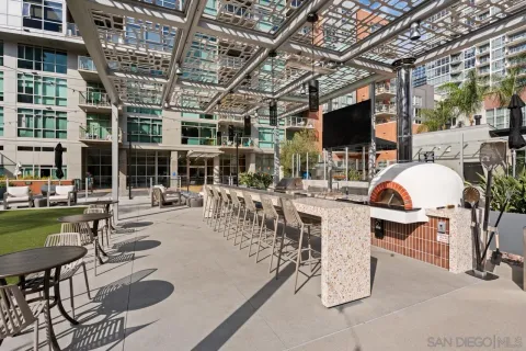 a view of a patio with dining table and chairs