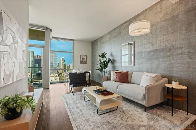 a living room with furniture and a potted plant