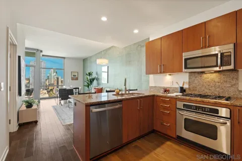 a kitchen with a sink stove and refrigerator