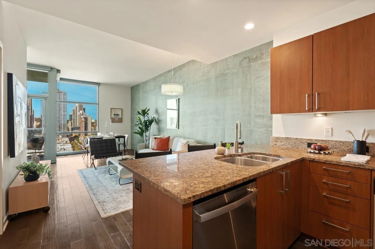 800 The Mark Lane, Unit 2103 San Diego, CA 92101 - Photo 10 of 25 a kitchen with granite countertop a sink stove and cabinets