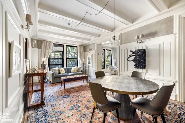 a dining room with furniture and window