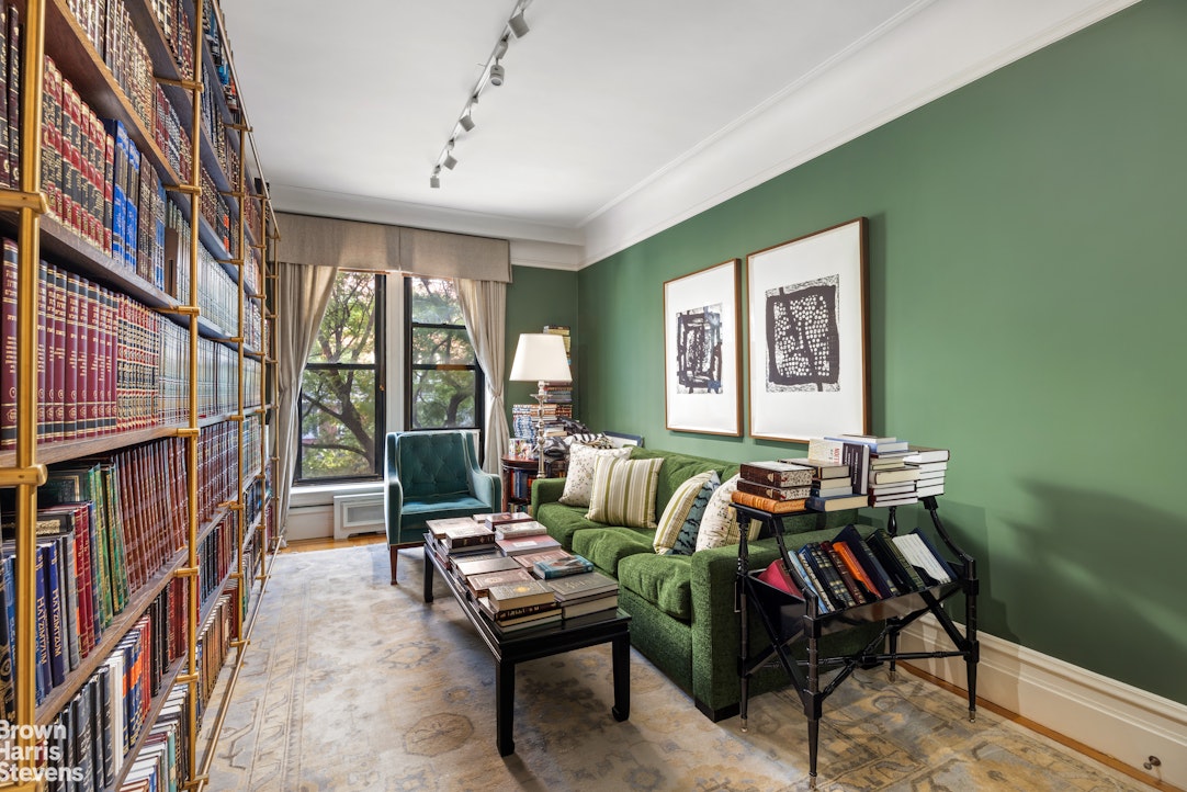 645 West End Avenue, Unit 2A Manhattan, NY 10025 - Photo 6 of 13 a living room with furniture a bookshelf and a window