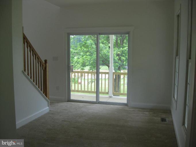 West Heaps Road Pylesville, MD 21132 - Photo 3 of 17 Den with Glass Sliders leading to porch
