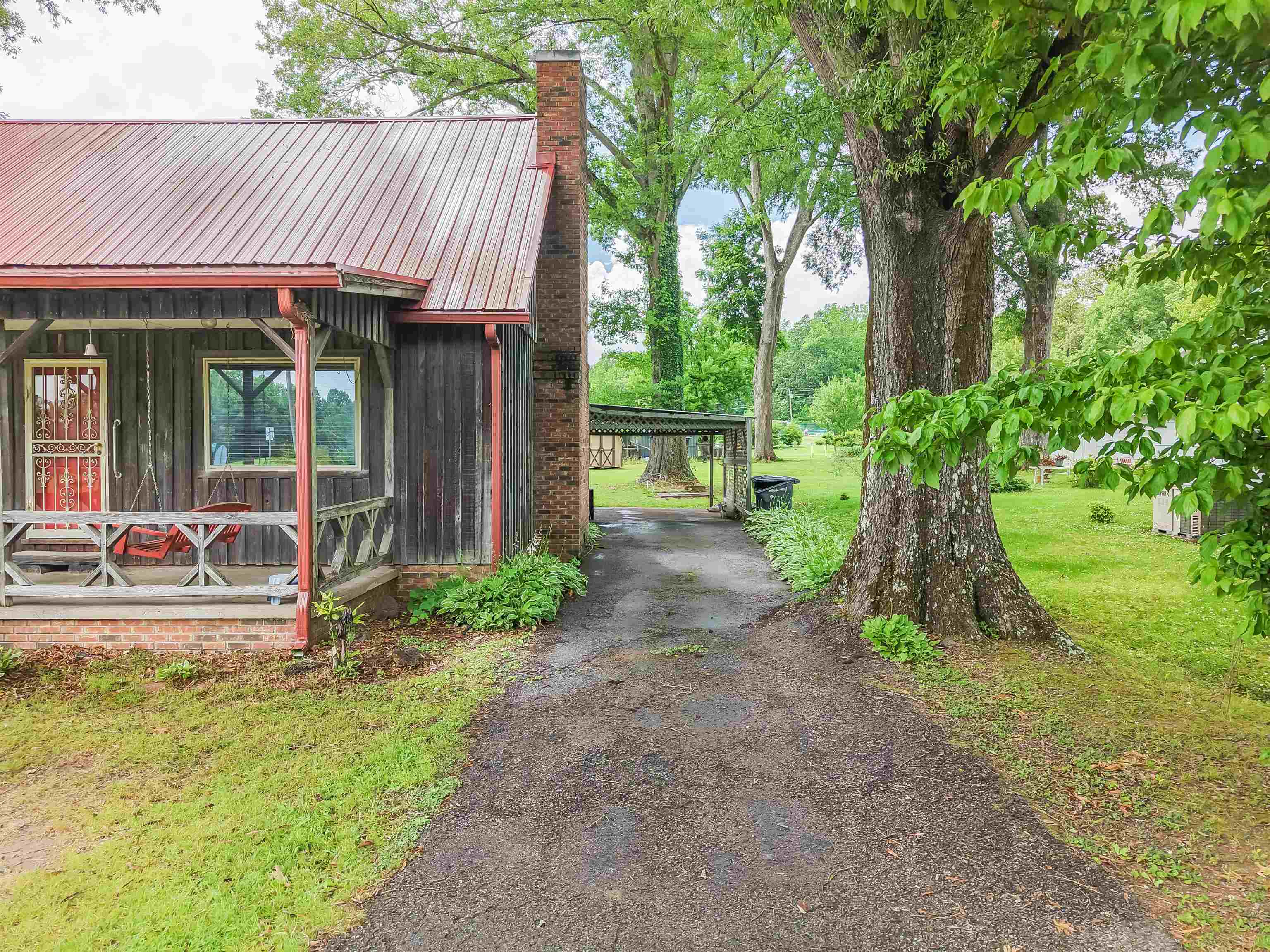 12 Baker Road Selmer, TN 38375 - Photo 5 of 28 a view of a house with backyard and sitting area