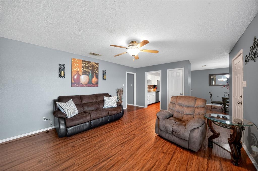604 McAnear Street Cleburne, TX 76033 - Photo 12 of 18 a living room with furniture and a wooden floor