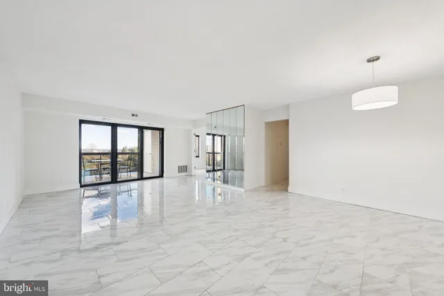 a view of an empty room with a window