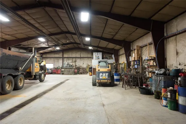 a view of parking garage with cars
