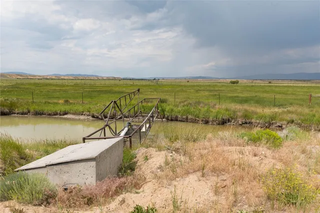 a view of a lake with a yard