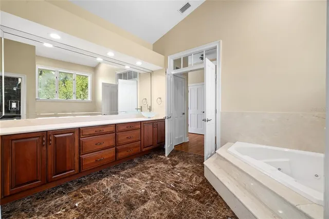 a view of room with window and ceiling fan