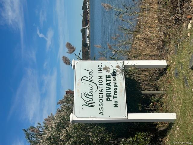 535 Bay Home Road Southold, NY 11971 - Photo 9 of 15 a sign on the side of the road