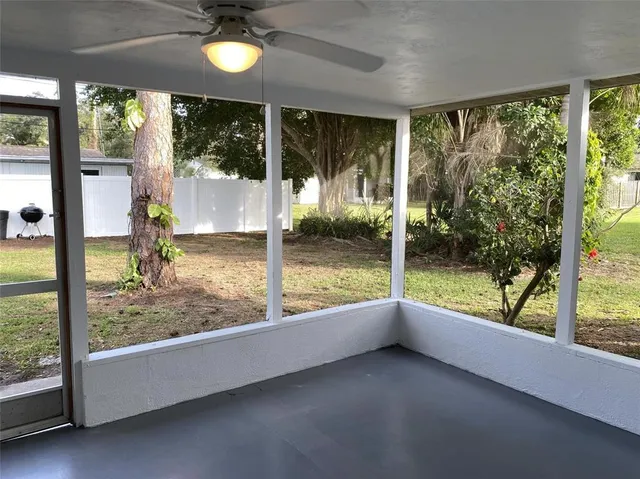 a view of room with window and pool view