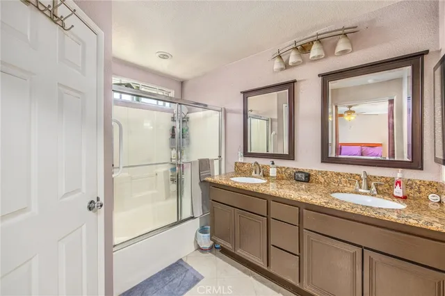a bathroom with a double vanity sink mirror and double