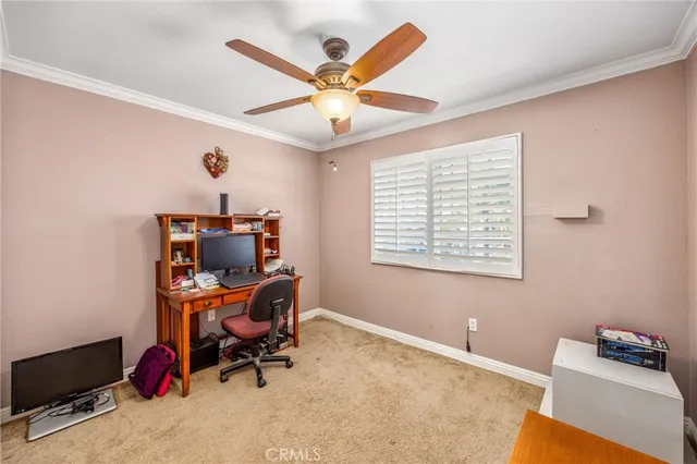 a workspace with furniture and a window
