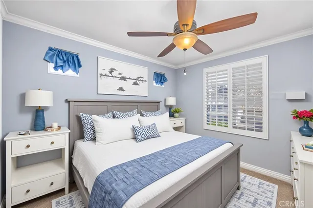 a bedroom with a large bed and a window