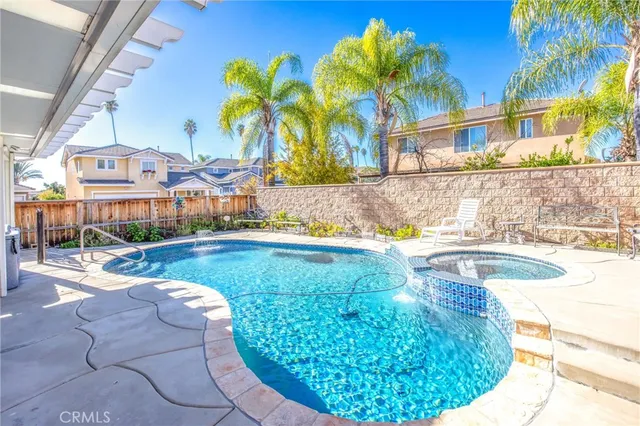 a view of a swimming pool with a patio