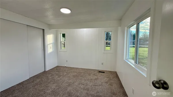 a view of an empty room with a window