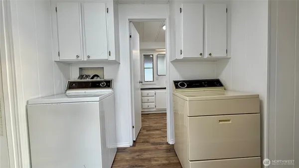 a utility room with closet dryer and washer