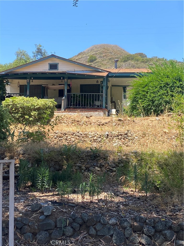 466 Stewart Canyon Road Fallbrook, CA 92028 - Photo 1 of 1 a front view of a house with a garden