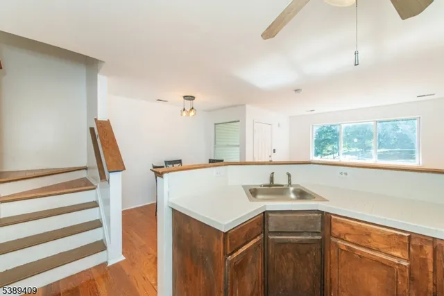 a kitchen that has a sink and a window in it
