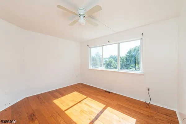 a view of a room with a large window