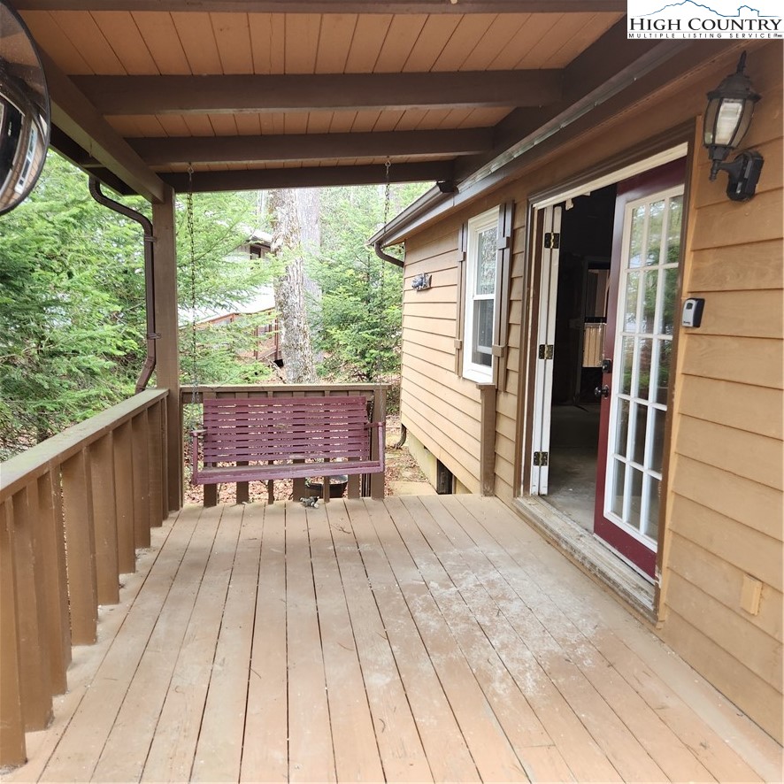 58 River Road Newland, NC 28657 - Photo 3 of 28 a view of outdoor space with deck and furniture